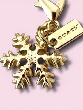Coach Gold-Tone Snowflake Bag Charm with Logo Branded Tag - Collectible Gift